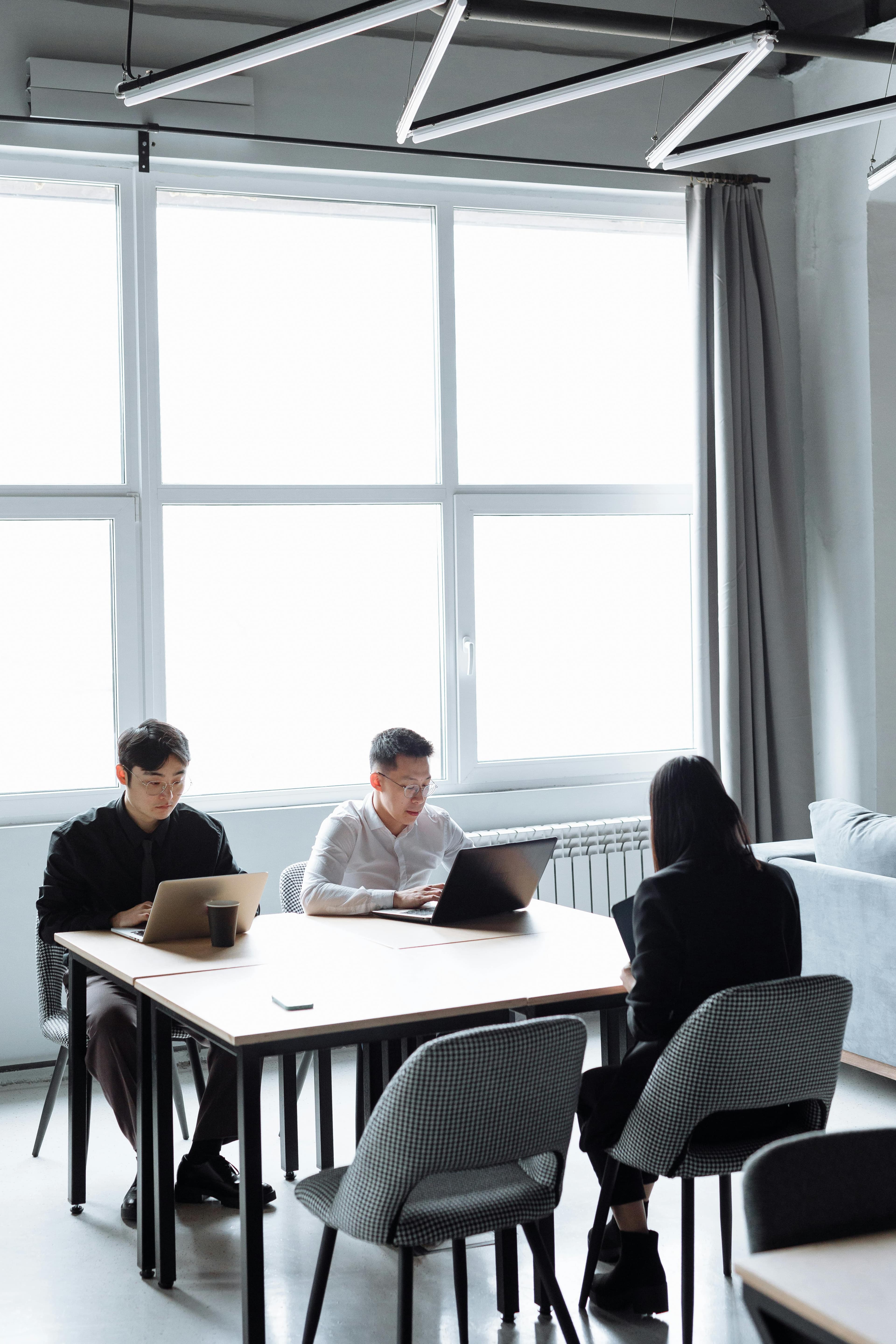 A cross-functional team reviewing charts and dashboards during a planning session.